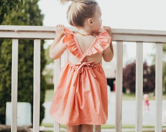 Coral Pin Dot Ruffle Dress. Peach Pink Dress Dress. Summer Dress. Kids Dresses. Toddler Dresses. Tank Dresses. Ruffle Dress. Polka Dot Dress