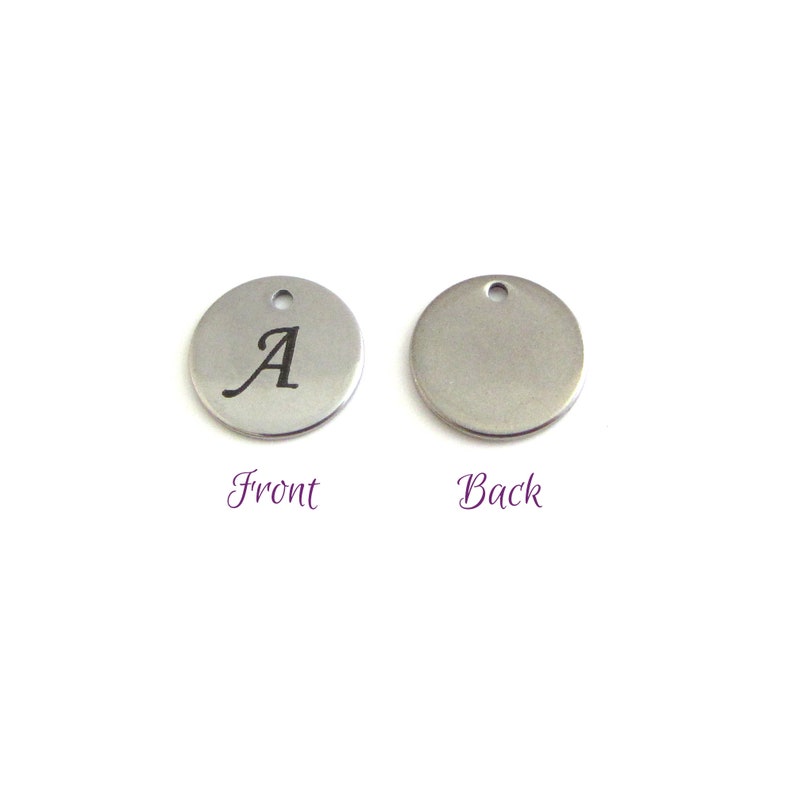 Two round letter disc charms, one with A, one blank, to show front and back of letter disc charm. With Front and Back written next to appropriate charms.