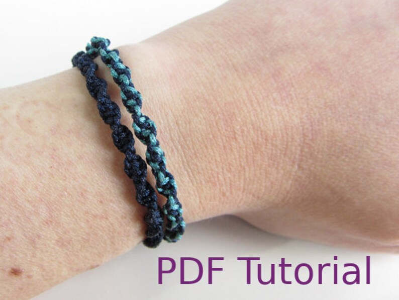 Two macrame half square knot bracelets with slider closures are shown worn on a wrist. The left bracelet is in a navy blue cord and the right one with light blue and navy blue cord. With PDF Tutorial written on the image.