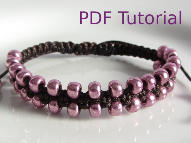 A close up of pink beaded brown macrame square knot bracelet with slider closure. Beads are arranged in two rows on the outside of the bracelet. With PDF Tutorial written on the image.