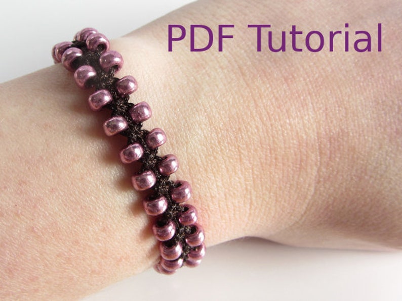 Pink beaded brown macrame square knot bracelet worn on wrist. Beads are arranged in two rows on the outside of the bracelet. With PDF Tutorial written on the image.