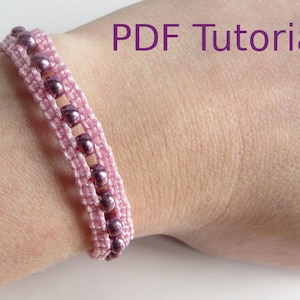 A bracelet that has a 3 row effect shown worn on wrist. The bottom and top rows are pink cord using macrame knots. The middle row is pink beads. With PDF Tutorial written on the image.