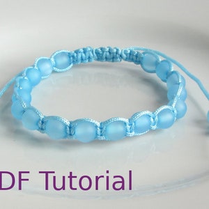 Light blue beaded macrame square knot bracelet with slider closure. With PDF Tutorial written on the image.