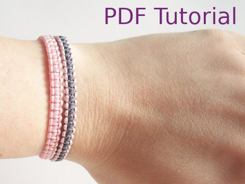 Two macrame square knot bracelets with slider closures are shown worn on a wrist. The left bracelet is in a pink cord and the right one with grey and pink cord. With PDF Tutorial written on the image.