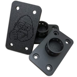 May include: Black metal mounting plates featuring a gorilla face design. Each plate has four holes for mounting and a circular base for attachment. The plates are shown against a white background.