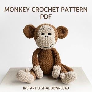 May include: A handmade crochet monkey in brown and beige. The monkey has large ears, a smiling face, and is sitting with its legs outstretched. The text "MONKEY CROCHET PATTERN PDF" and "INSTANT DIGITAL DOWNLOAD" are displayed above and below the monkey.