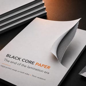 May include: A stack of white cardstock with a black core, featuring a torn corner revealing the dark interior. The text reads: BLACK CORE PAPER, The end of the lamination era, Inkjet printer ready on both sides, Thick cardstock. A logo with a dog paw print is visible.