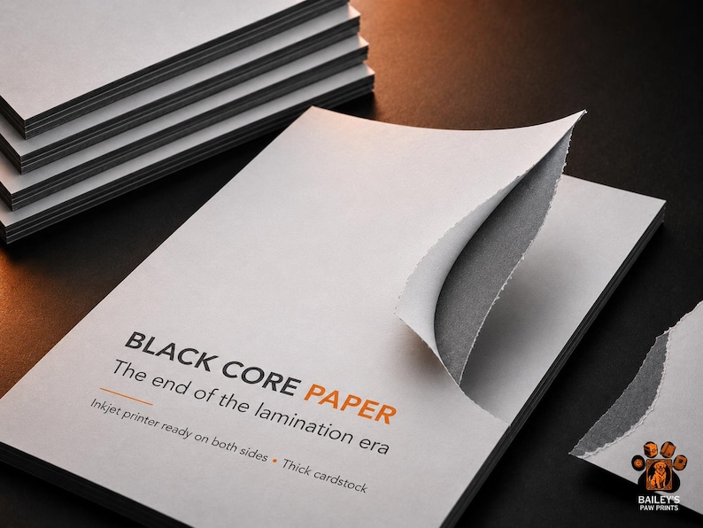 May include: A stack of white cardstock with a black core, featuring a torn corner revealing the dark interior. The text reads: BLACK CORE PAPER, The end of the lamination era, Inkjet printer ready on both sides, Thick cardstock. A logo with a dog paw print is visible.