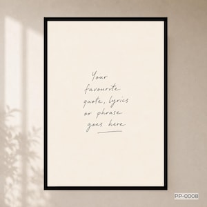 May include: A rectangular wall art print in a thin black frame featuring a cream-coloured background with the handwritten black text: Your favourite quote, lyrics or phrase goes here. The bottom right corner displays the small text code PP-0008.