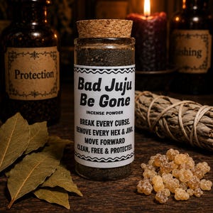 May include: A clear glass jar filled with dark incense powder, sealed with a cork stopper. The white label reads: Bad Juju Be Gone, INCENSE POWDER, BREAK EVERY CURSE, REMOVE EVERY HEX & JINX, MOVE FORWARD, CLEAN, FREE & PROTECTED.