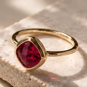 Bezel-Set Cushion Cut Ruby Ring – 18K Gold Solitaire Statement Jewelry