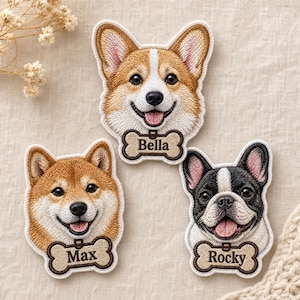 May include: Three embroidered dog patches featuring a Corgi, a Shiba Inu, and a French Bulldog. Each dog has a bone-shaped name tag underneath with the names Bella, Max, and Rocky stitched in black thread on a tan background with brown borders.