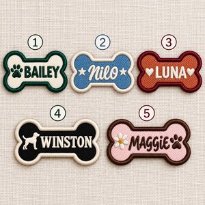 May include: Five bone-shaped embroidered patches with cream borders. Patch 1 is cream with green text BAILEY and a paw print. Patch 2 is blue with white text Nilo and stars. Patch 3 is orange with white text LUNA and hearts. Patch 4 is black with white text WINSTON and a dog silhouette. Patch 5 is pink with brown text MAGGIE, a daisy, and a paw print.