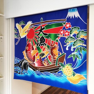 May include: A blue fabric tapestry with a Japanese design featuring a boat filled with fish, a lobster, and a crab. The boat is surrounded by waves and a mountain in the background. The text "大漁" is written in Japanese characters on the tapestry.