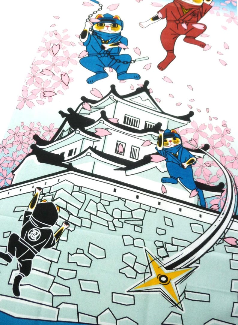 May include: A fabric print featuring cartoon cats dressed as ninjas in blue, red, and black outfits. The cats are depicted climbing a white Japanese castle wall and jumping through the air amidst falling pink cherry blossom petals and a yellow shuriken.