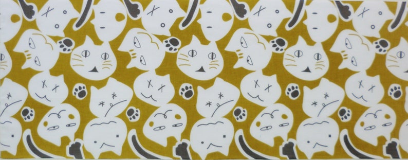 May include: A repeating pattern of white cats with black eyes and noses on a mustard yellow background. The cats are in various poses, some are looking to the left, some to the right, and some are looking straight ahead. The cats are all outlined in black.