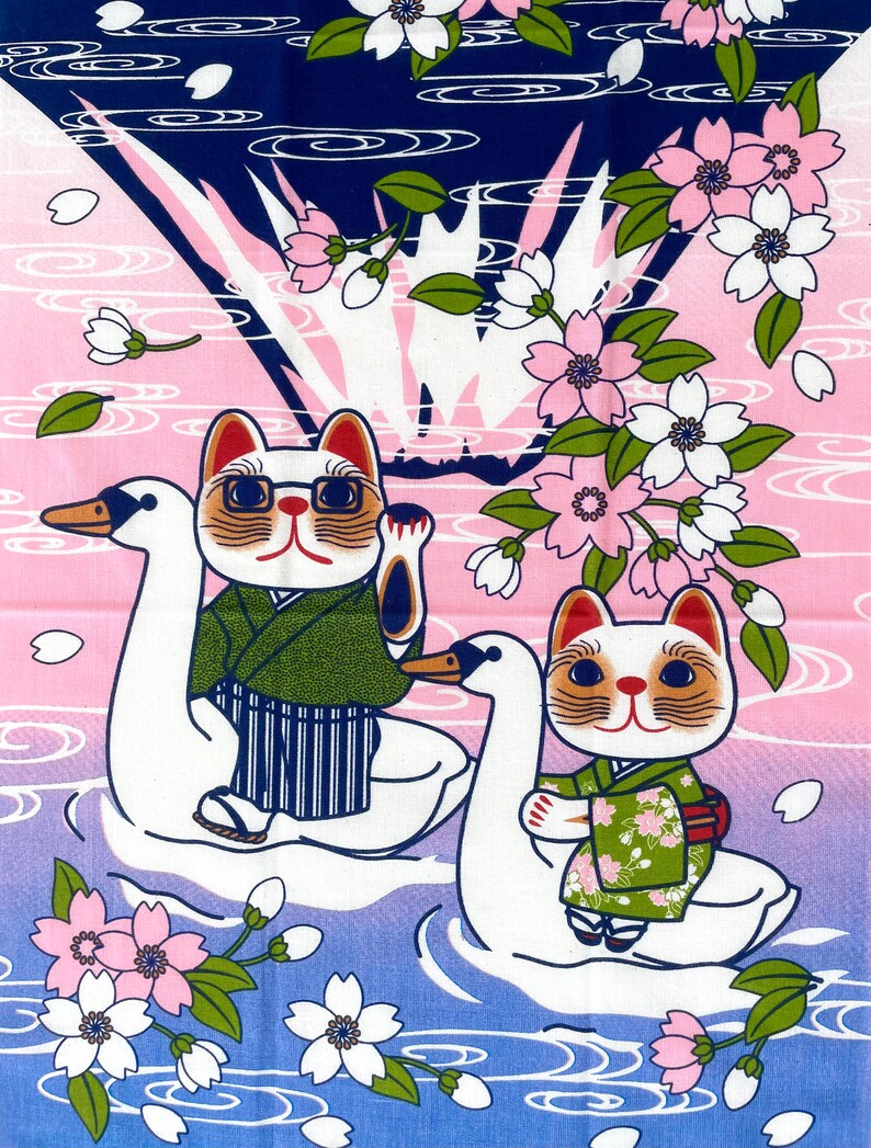 May include: A fabric print featuring two cats wearing green kimonos riding white swans on a blue and pink water background. The scene is decorated with pink cherry blossoms and white petals, with one cat wearing glasses and waving a paw.