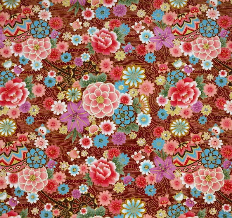May include: A deep red fabric featuring a repeating pattern of pink peonies, purple lilies, and light blue flowers. The background is filled with thin, wavy gold lines that create a flowing texture throughout the entire floral design.