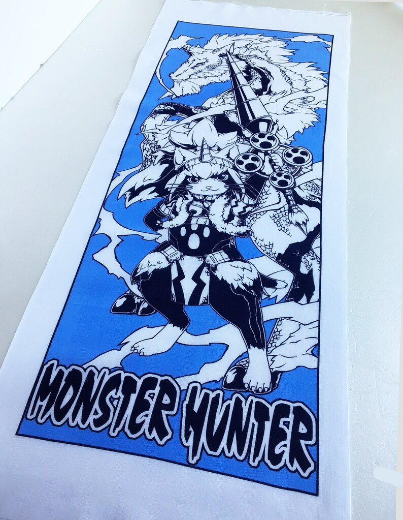 May include: A blue and white Monster Hunter themed fabric panel featuring a black and white illustration of a character with a horn on its head, holding a spear and standing on a dragon.