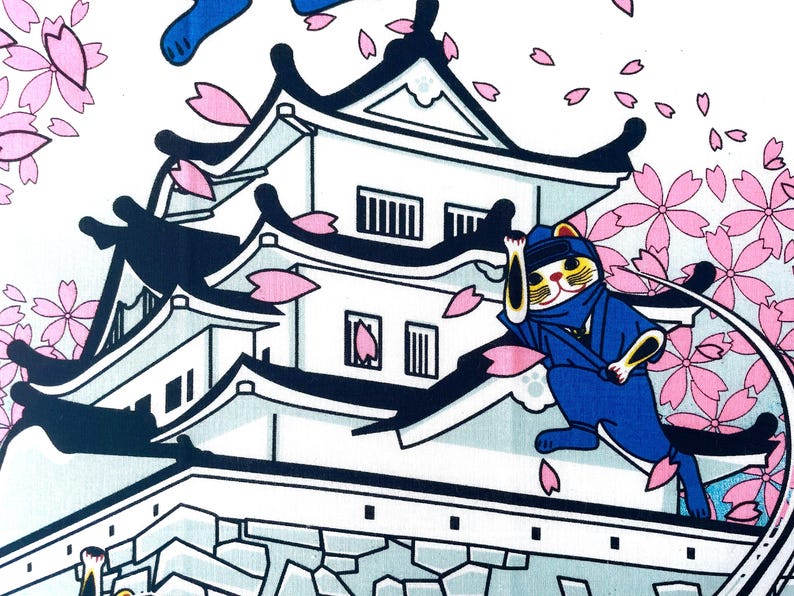May include: A white fabric print featuring a black and white Japanese castle with multiple tiers and dark roof accents. A blue ninja cat is positioned on the roof, surrounded by falling pink cherry blossom petals against a white background.