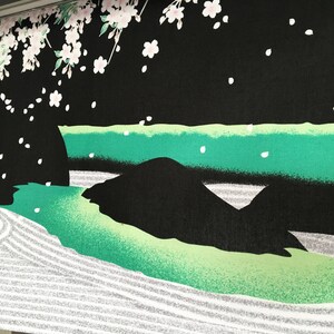 May include: Black fabric with a green and white Japanese garden design. The design features a river, rocks, and a sand garden with raked lines.