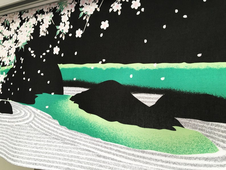May include: Black fabric with a green and white Japanese garden design. The design features a river, rocks, and a sand garden with raked lines.