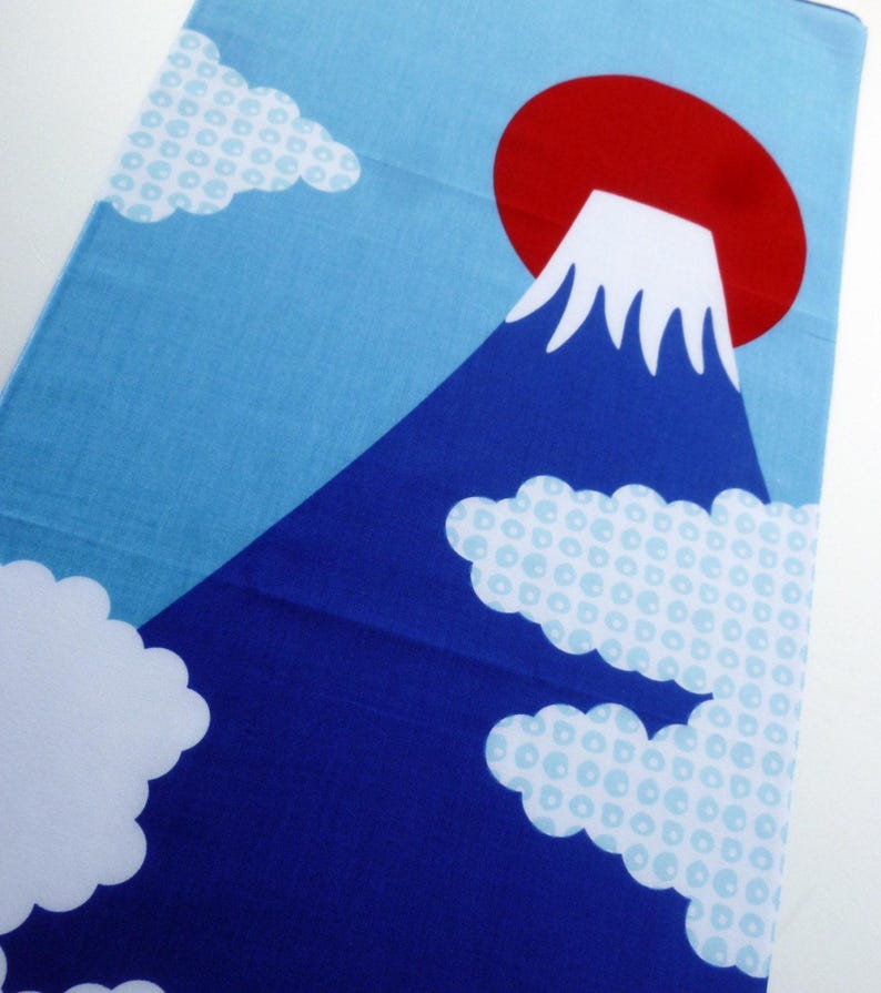 May include: A rectangular fabric panel featuring a graphic print of a dark blue mountain with a white snow-capped peak. A large solid red circle sits behind the mountain against a light blue sky. White clouds with a light blue circular pattern.