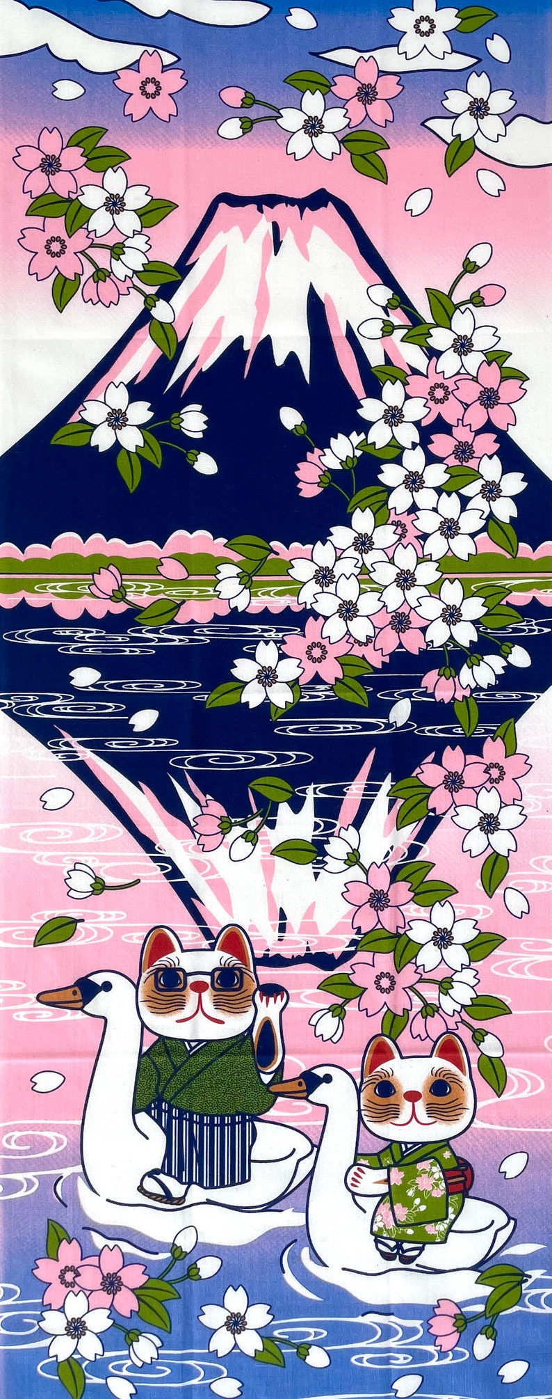 May include: A rectangular fabric print featuring a dark blue Mount Fuji silhouette against a pink and blue sky, surrounded by white and pink cherry blossoms. Two cats wearing green kimonos ride white swan-shaped pedal boats on pink water.