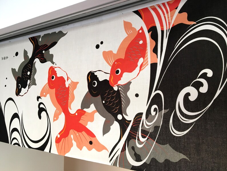 May include: A white fabric panel with a black and red Japanese-style design featuring stylized fish and waves. The text "海神" is written in black on the top left corner of the panel.