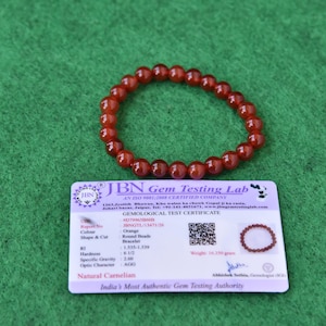 Pulseira Premium de Contas Laranja – Joia Tradicional Elegante”.
