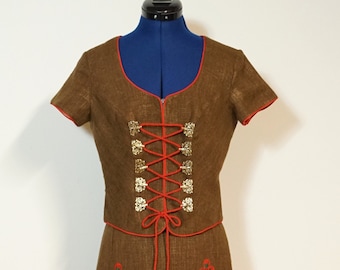 Traditional two-piece dress, brown with embroidery, traditional costume with a narrow skirt and short-sleeved spencer with lacing