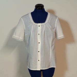 Traditional blouse with short sleeves, white blouse with lace