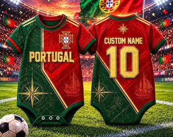 May include: Two baby bodysuits with a soccer theme. The front of the red and green bodysuit says "PORTUGAL" and features a compass rose design. The back has "CUSTOM NAME" and the number "10" in gold. A soccer ball rests on the grass.