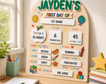 May include: A light-colored wooden arched sign titled JAYDEN'S FIRST DAY OF 1ST GRADE. It features sections for age 6 years old, height 45 inches tall, date 25 AUGUST, and favorites including hotdog, green, and puppy. It also lists running, firefighter, and teacher MR. DAVIS.