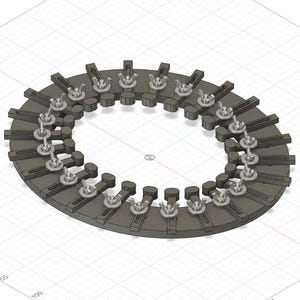 Könnte beinhalten: Eine kreisförmige, dunkelgraue mechanische Komponente mit einer Reihe verstellbarer radialer Arme, die mit silberfarbenen Metallflügelmuttern befestigt sind. Das Gerät ist auf einer Rasterfläche positioniert und zeigt eine symmetrische Anordnung.