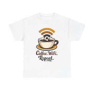 May include: A white short-sleeve t-shirt featuring a graphic of a coffee cup on a saucer with a brown Wi-Fi signal icon rising from the cup. Below the graphic, the text reads Coffee. Wifi. Repeat. in a brown, stylized, sans-serif font.