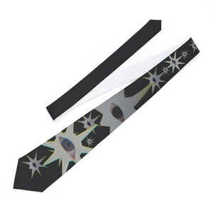 May include: A necktie featuring a dark charcoal background with a repeating pattern of white star-shaped motifs. Each star contains a realistic human eye at its center, with subtle blue and yellow highlights along the edges of the star points.