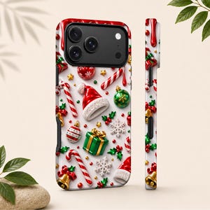 May include: A smartphone case featuring a festive Christmas pattern on a white background. The design includes red and white candy canes, green and gold gift boxes, Santa hats, green and red ornaments, gold bells, and white snowflakes.