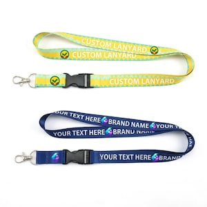 May include: Two lanyards with black plastic buckles and silver metal swivel hooks. The top lanyard is yellow with a light blue wavy pattern and the text CUSTOM LANYARD. The bottom lanyard is dark blue with the text YOUR TEXT HERE BRAND NAME.