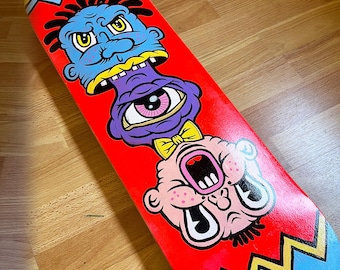 Psychedelic Stacked Monster Skate Deck | Vibrant Red Grotesque Art Skateboard