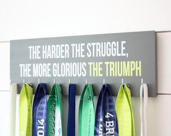 Titular de la medalla - Cuanto más difícil sea la lucha, más glorioso será el triunfo.  - Medio - Cita motivacional - Inspiradora