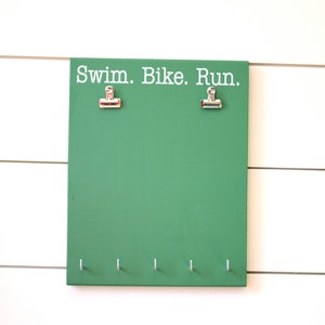 Titular de la Medalla de Triatlón - Natación. Bicicleta. Ejecutar. - Titular de la carrera Bib & Medal