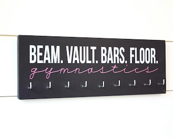 Soporte/exhibición de medalla de gimnasta - Gimnasia de piso con barra de salto con viga
