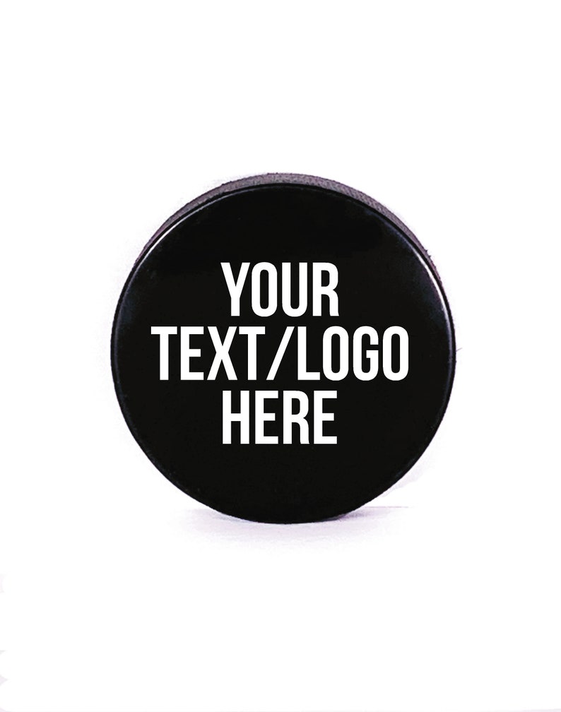 May include: Black hockey puck with white text that says "YOUR TEXT/LOGO HERE".