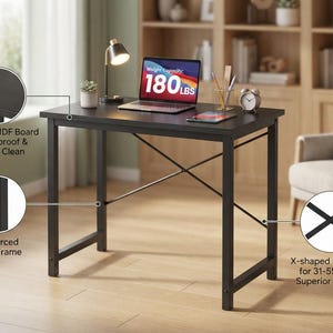 May include: A black rectangular desk with a reinforced metal frame and an X-shaped support structure. The desk surface is made of premium MDF board. Text on the image indicates a weight capacity of 180 lbs and an X-shaped structure for stability.