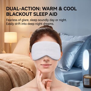 May include: A white blackout sleep aid eye mask with a dark grey trim is worn by a person. The image includes text that reads "DUAL-ACTION: WARM & COOL BLACKOUT SLEEP AID" and "Fearless of glare, sleep soundly day or night. Easily drift into deep night dreams."
