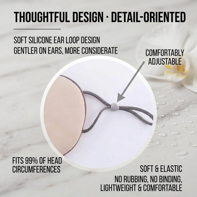May include: A beige face mask with grey adjustable ear loops. The mask is described as soft, elastic, and comfortable, with a design that is gentle on the ears. Text on the image reads: "Thoughtful Design - Detail-Oriented."