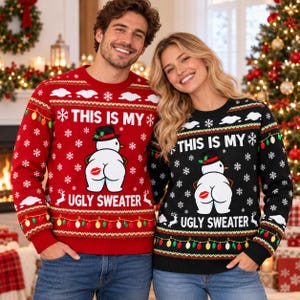 May include: A red and a black long-sleeve crewneck jumper, each featuring a graphic of a snowman wearing a hat with a red kiss mark on its backside. The jumpers include the text THIS IS MY UGLY SWEATER, white snowflakes, and colourful light bulbs.