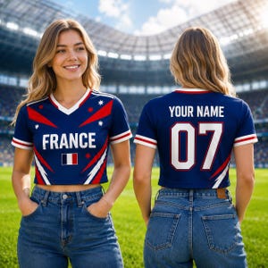 May include: Two cropped navy blue t-shirts with white and red accents. One shirt says "FRANCE" with the French flag and the other says "YOUR NAME" and the number "07". Both shirts have a V-neck and are worn with blue jeans.
