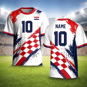 May include: White soccer jersey with red and blue brushstroke design, a Croatian flag, and the number 10 in navy blue. The jersey has a red and white checkered pattern and the word "NAME" on the back.